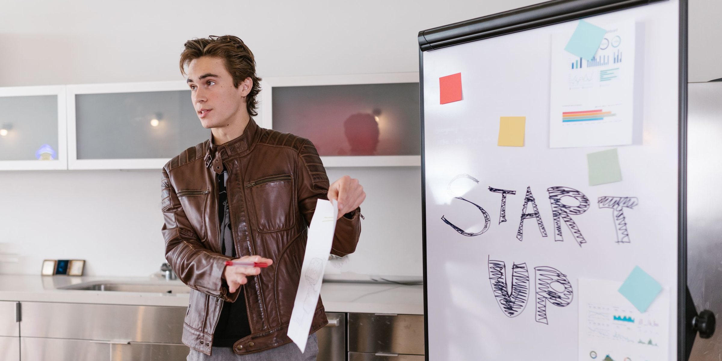 Entrepreneur presenting a start-up plan on a flip chart